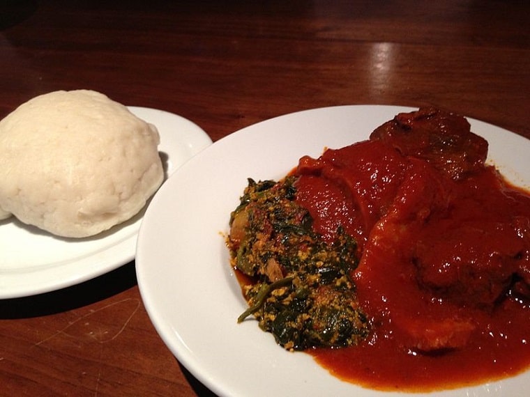 A plate of pounded yam (Iyan) and egusi soup.