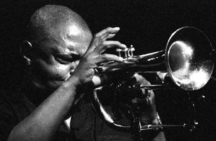 Hugh Ramopolo Masekela playing the trumpet.