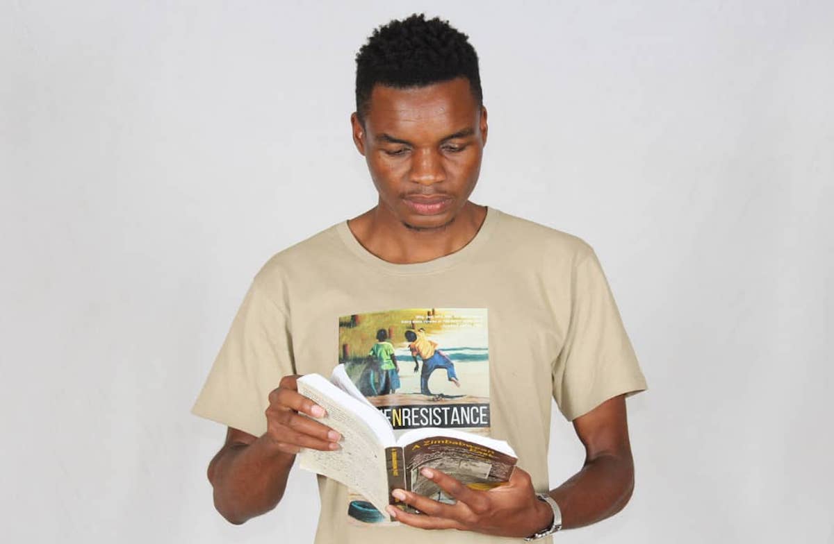 Onai Mushava reading a book, Shortly after the publication of "Rhyme and Resistance" in 2019