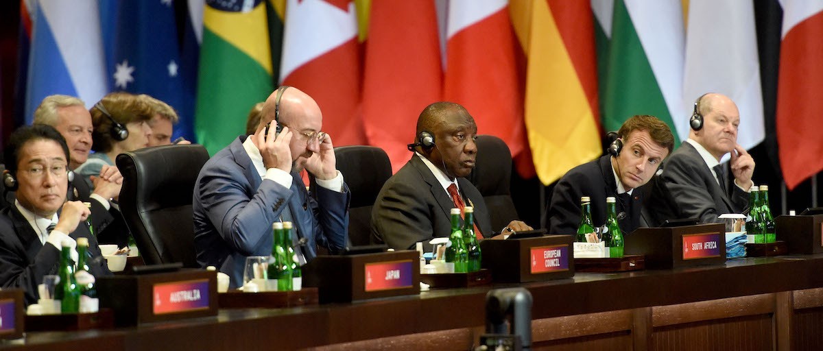 South African President Cyril Ramaphosa sits with G20 leaders including French President Emmanuel Macron.