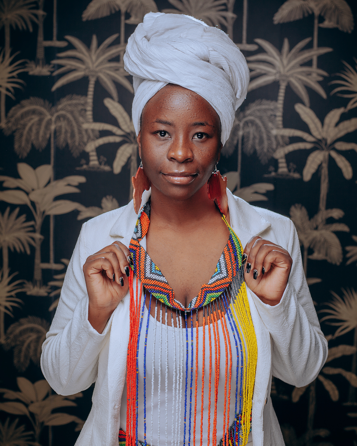 Wezi is a Zambian singer, songwriter and rights advocate.
