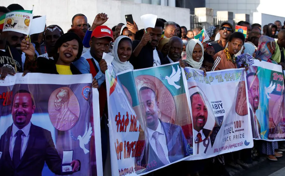 Women holding banners of abbey Ahmed