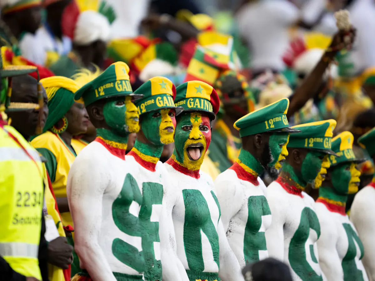 Senegal supporters wearing colourful costumes