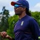 Malibongwe Maketa holding a red cricket ball.