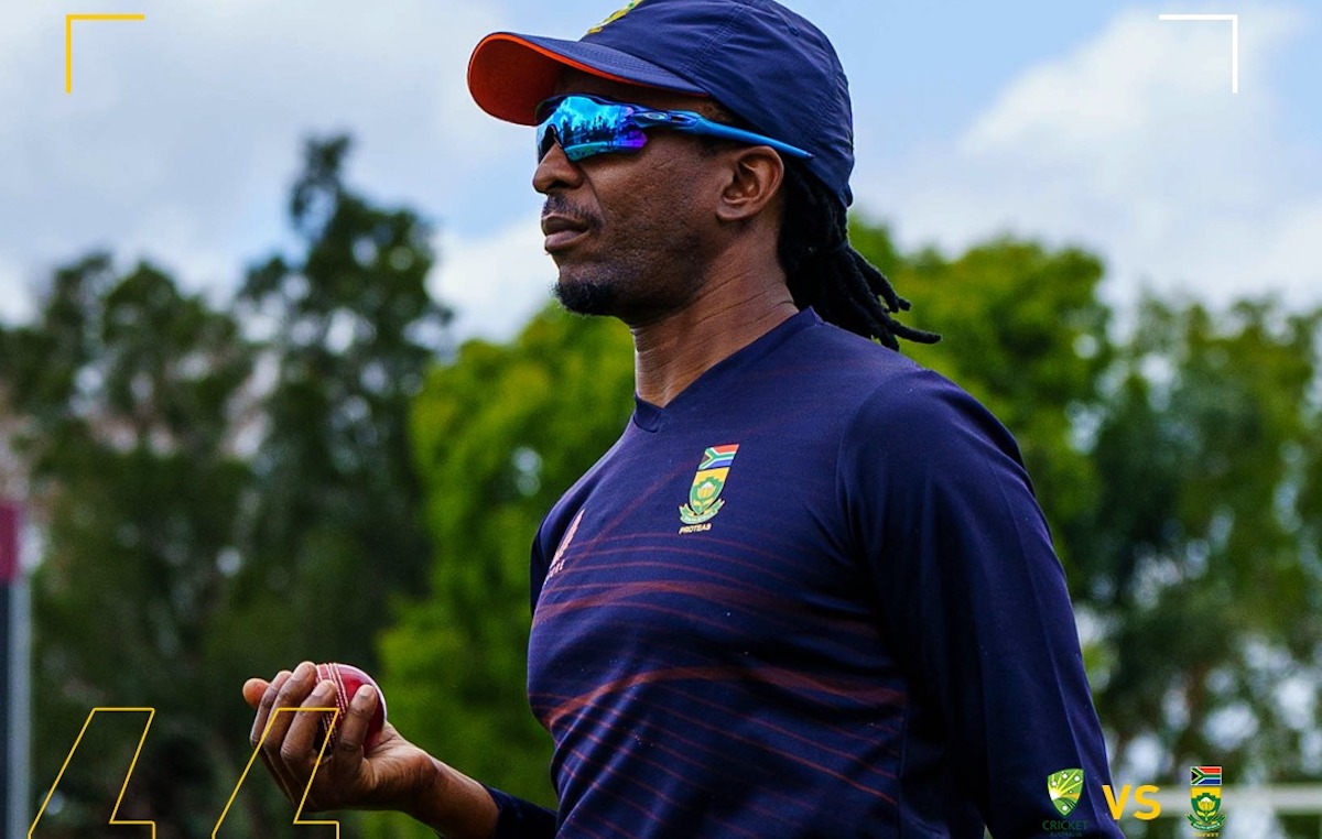 Malibongwe Maketa holding a red cricket ball.