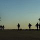 U.S. Soldiers with the 20th Special Forces Group walk on a flight line in Gulfport, Miss., May 5, 2014, during Emerald Warrior 2014.