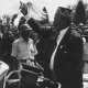 Kenya’s first president Jomo Kenyatta waves at a crowd.