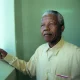Nelson Mandela revisiting his cell at Robben Island prison. The image was sold to support his charitable causes. Louise Gubb/Corbis via Getty Images