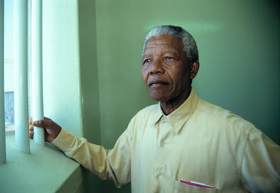 Nelson Mandela revisiting his cell at Robben Island prison. The image was sold to support his charitable causes. Louise Gubb/Corbis via Getty Images