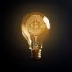Bitcoin symbol illuminated in a light bulb. Image credit: AI generated/ThisIsAfrica.