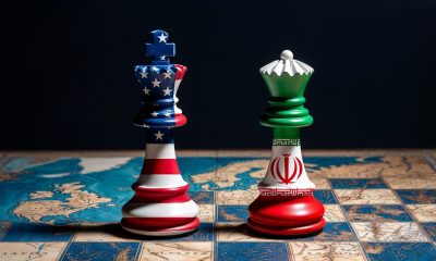 Render of a chessboard decorated with a map of the earth and with pieces decorated with the American and Iranian flag. Photo: This is Africa Library.
